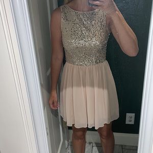 Blush party dress with sequence on top.